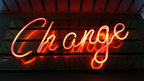 neon sign stating 'change'