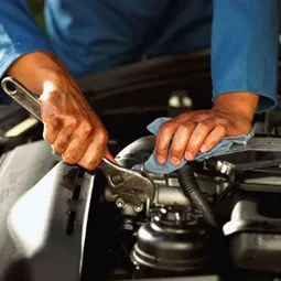 Mechanic fixing car