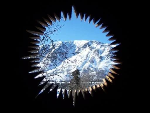 View of mountains from an outhouse door