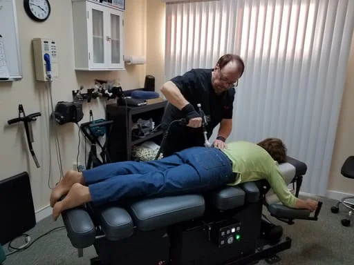 Dr. Mays adjusting patient