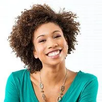 Image of woman smiling at camera. 