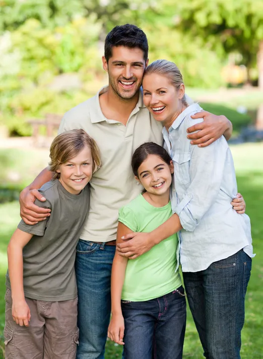 family posing outdoors in park, family dentistry North York, ON dentist