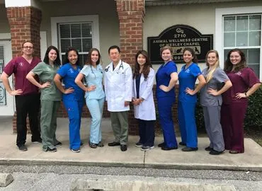 staff in front of building