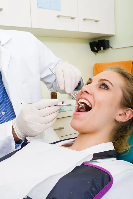 Photo of a woman during her dental exam and teeth cleaning in Franklin, IN