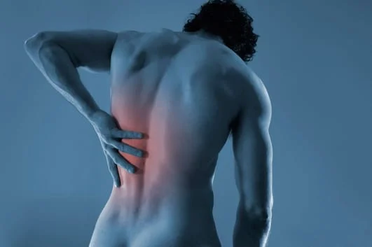 man enduring back pain