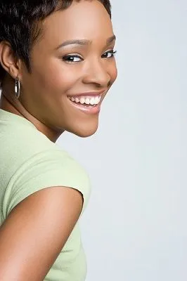 black woman with short hair smiling, nice teeth, cosmetic dentistry Cockeysville, MD dentist