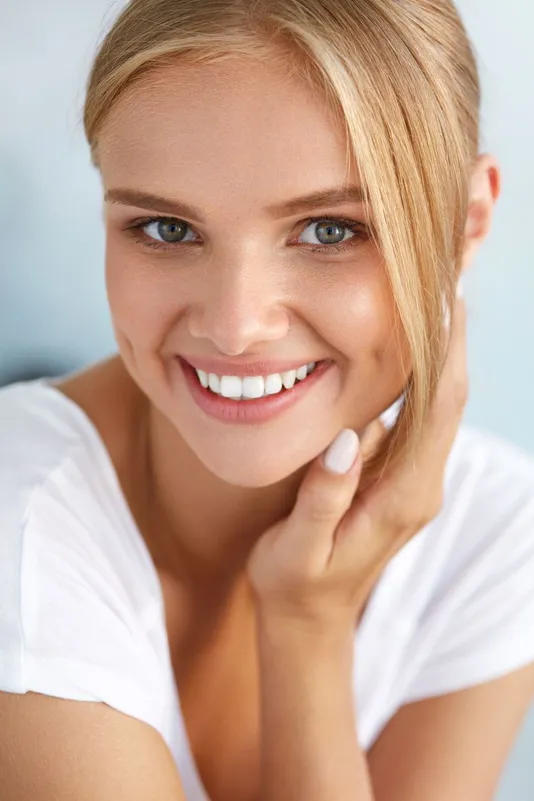 blond woman smiling nice white straight teeth, Invisalign Royal Palm Beach, FL dentist