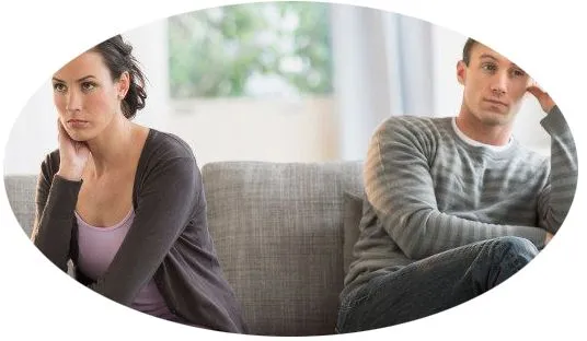 woman and man sitting far apart during counseling session