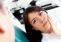 Photograph of woman in need of a filling at her dentist in Millbrae, CA