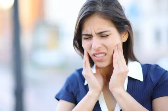 Woman with TMJ pain 