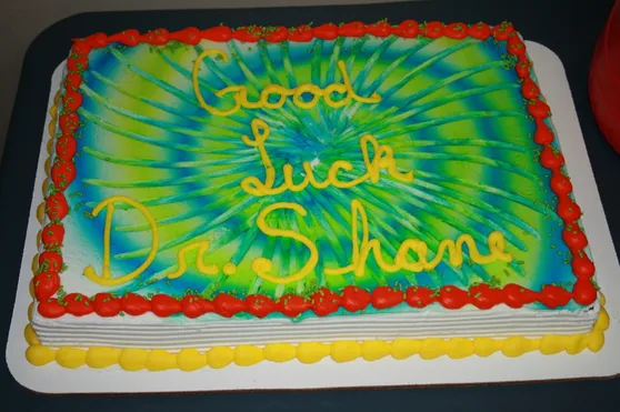 Image of a cake that reads good luck Dr. Shane