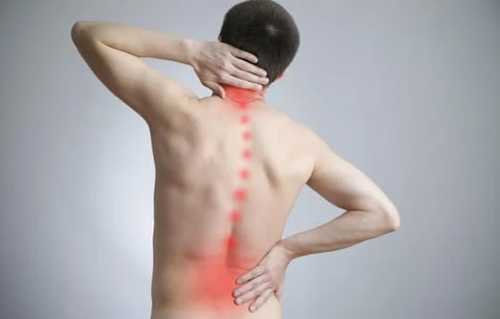 man with back pain before spinal decompression treatment with rowland heights chiropractor