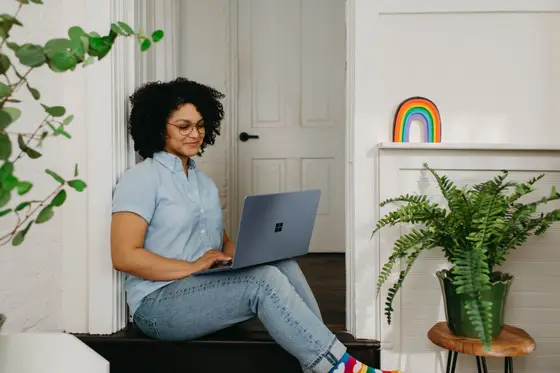 Multi-racial girl looking at laptop