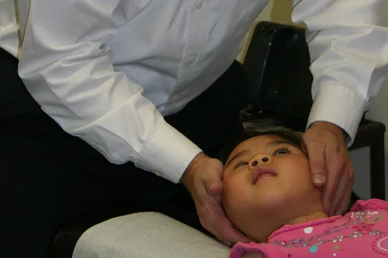 child being treated by the doctor
