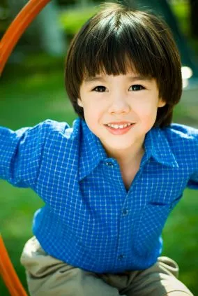 Boy with blue shirt.