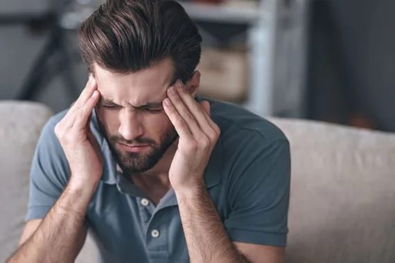 Man with headaches needs chiropractic care in Glen Carbon, Illinois.