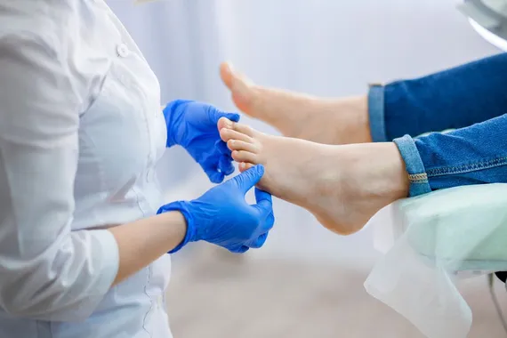 podiatrist examining feet