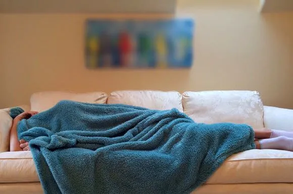 person sleeping on couch