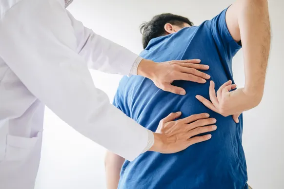 doctor examining back