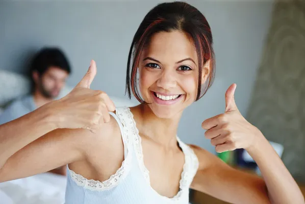 woman giving thumbs up after getting dental filling no more pain, dentist Royal Palm Beach, FL