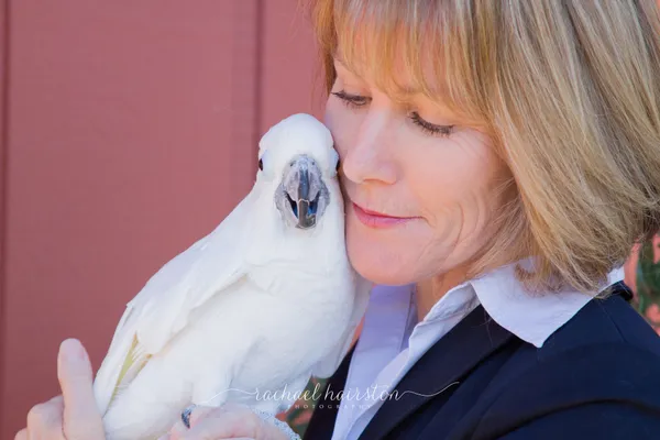 Sheri Smith with Chipper the Triton Cockatoo