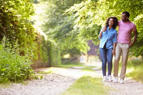 couple walking on a gravel path