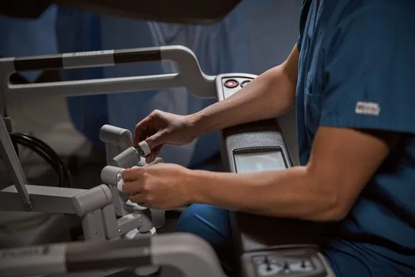 Surgeon's hands on the controls