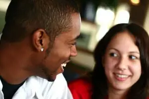 man and woman smiling at each other