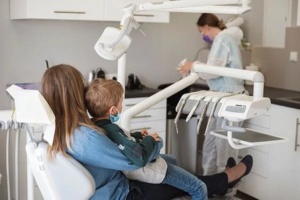 mother and child in dental chair