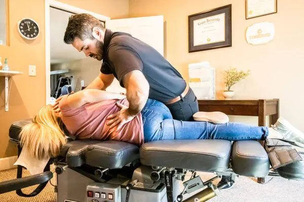 Doctor adjusting patient