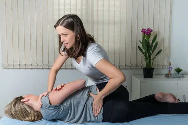 Gonstead treatment on female patient