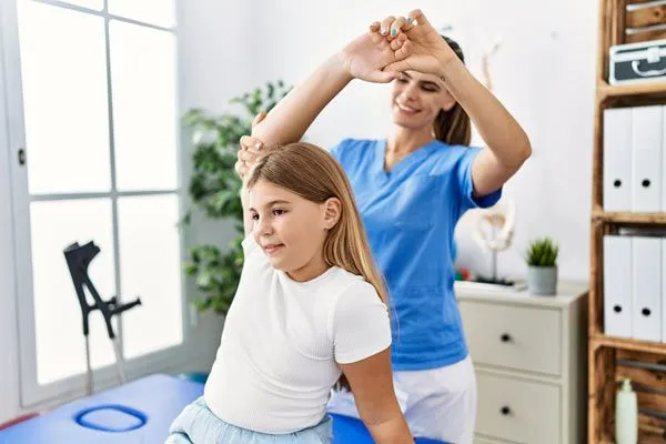 young girl receiving chiropractic treatment