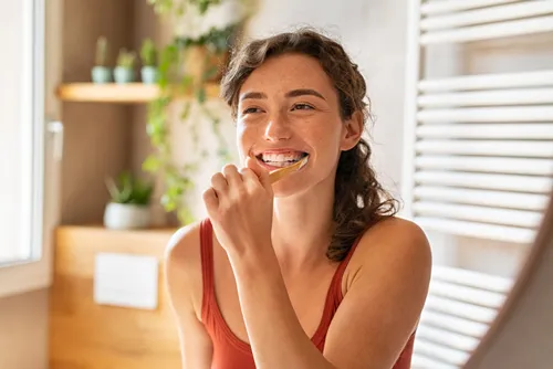 woman brushing teeth