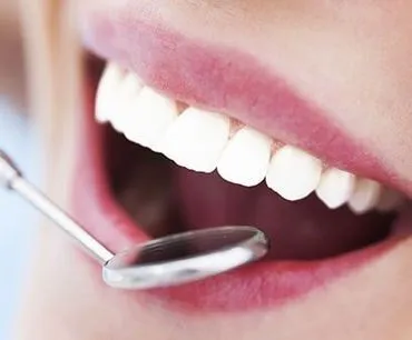 close up of mouth and dental mirror, cosmetic dentistry Mt Airy, NC dentist