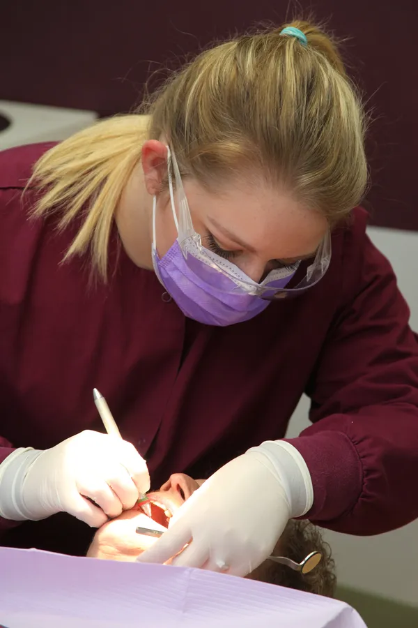 katey-cleaning-patient-teeth