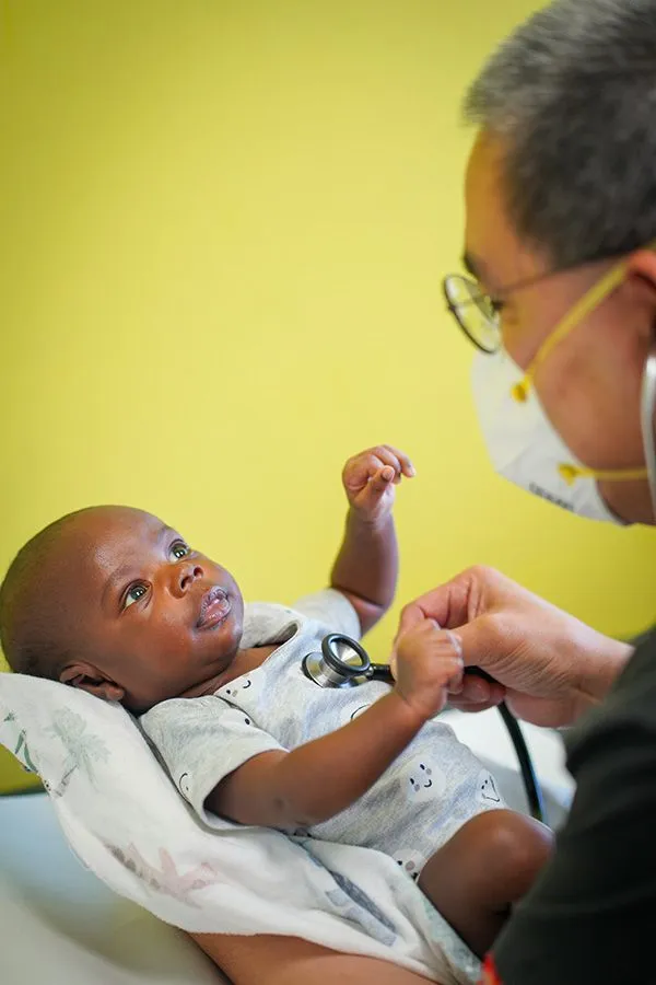 Doctor giving newborn care