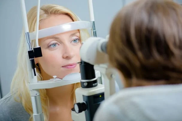 woman receiving an eye and vision exam
