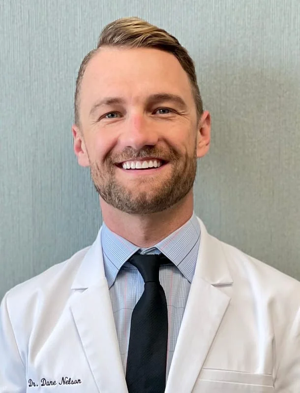 Please welcome Dr. Dane Nelson as the new owner and doctor of Aberdeen Dental! Dr. Nelson grew up in Stillwater, Minnesota. He attended the University of Wisconsin-Madison where he graduated with honors. He then returned to the University of Minnesota School of Dentistry where he earned his Doctorate in Dental Surgery (DDS) degree in 2016. After graduation, he started his career serving our country as a lieutenant in the U.S. Navy Dental Corps. During his active duty time, he completed an Advanced Education in General Dentistry residency in the Chicago area, served overseas at a Marine Corps base in Iwakuni, Japan where he was awarded a Navy & Marine Corps achievement medal for his excellence in clinical work, and led a dental clinic in Washington state. Dr. Nelson has over 8 years of clinical experience, and over 4 years in private practice. He has treated tens of thousands of patients of all ages and dental needs in his career and he is now excited to fulfill his dream of owning a dental practice! Dr. Nelson is particularly passionate about comprehensive patient care, especially restoring or replacing missing teeth for esthetic and healthy smiles. He keeps up on these modern dental treatments through extensive continuing education coursework and has completed over 10 times the required hours needed to keep his license active. He has completed extensive training in esthetic dentistry and surgical implant dentistry including a year-long implant surgery program with the American Academy of Implant Dentistry held in Vancouver, Canada. In his personal life, Dr. Nelson is an avid traveler and sports & outdoors enthusiast. He has even lived abroad in three different countries - Spain, Denmark & Japan! He enjoys running, biking, hiking, camping, fishing, snowboarding, nordic skiing, and spending time with his family & friends. Dr. Nelson is excited to meet you and to take great care of the patients of Aberdeen Dental!