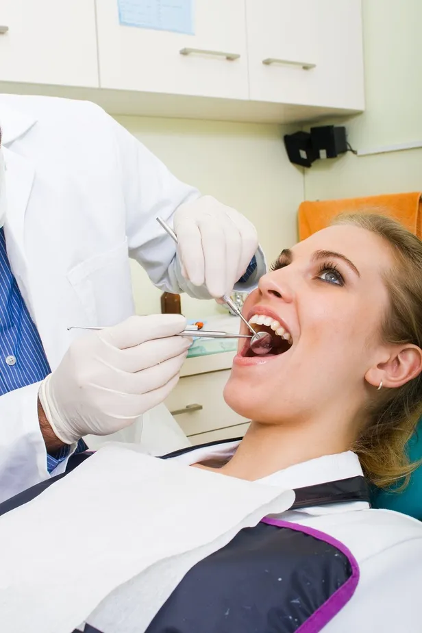 Photo of woman during her dental exam and teeth cleaning in Modesto, CA