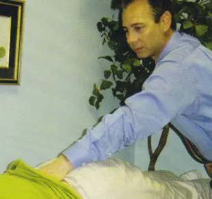 Image of man doing back adjustment