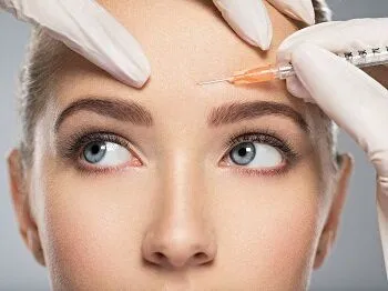 woman getting Botox injection treatment into forehead at dentist, Botox Santa Rosa Beach, FL dentist