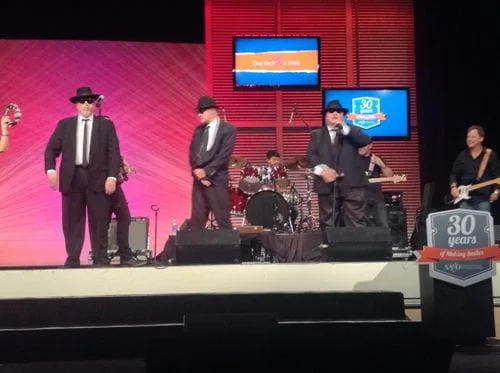 Dr. Okuda Playing the Drums at a Dental Conference