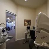 image of front desk assistant helping person fill out paperwork. 