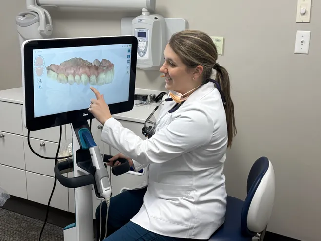 Dr. Katrina Thatch looking at dental imaging on computer screen, dentist Colonial Heights, VA cosmetic dentistry