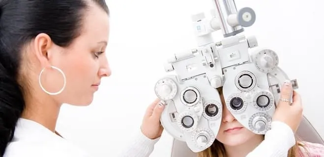 an optometrist conducting vision exam