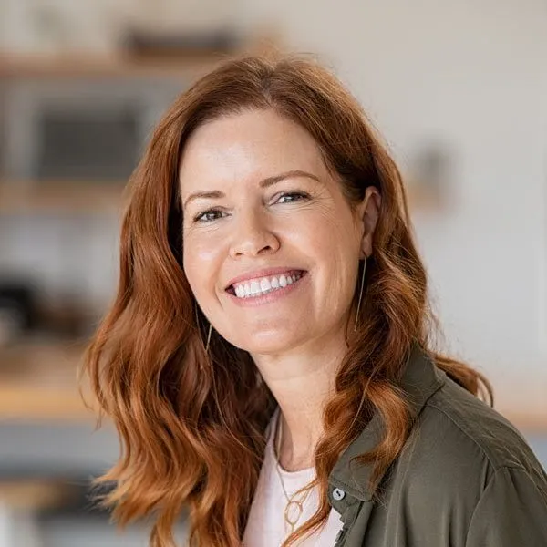 smiling woman with red hair