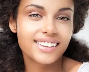 Photograph of a woman with a beautiful smile after her cosmetic dentistry services in Greenfield, WI