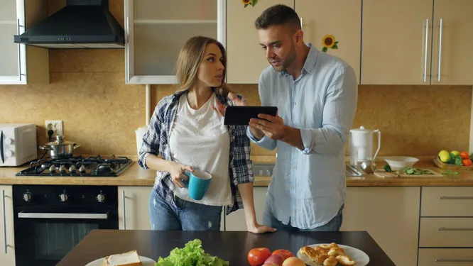 Person sitting in front of an audio mixer