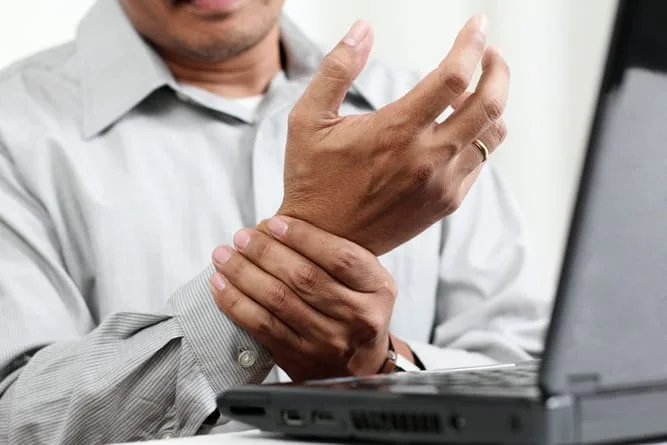 man suffering from carpal tunnel syndrome