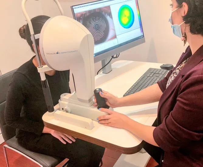 Patient Sitting At Keratograph Machine